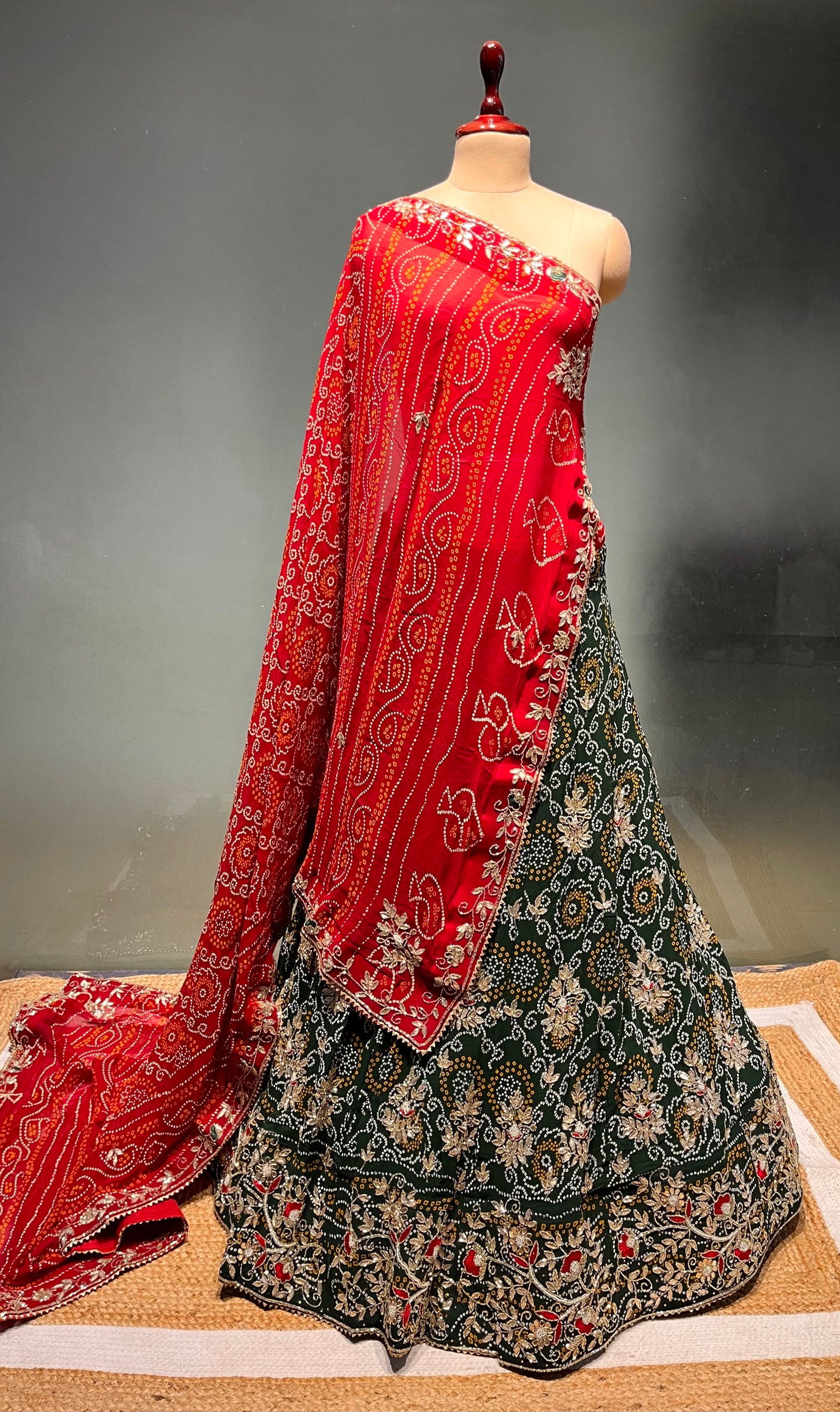 GREEN COLOUR GEORGETTE BANDHANI LEHENGA WITH UNSTITCHED BLOUSE EMBELLISHED WITH CUTDANA & GOTA PATTI WORK