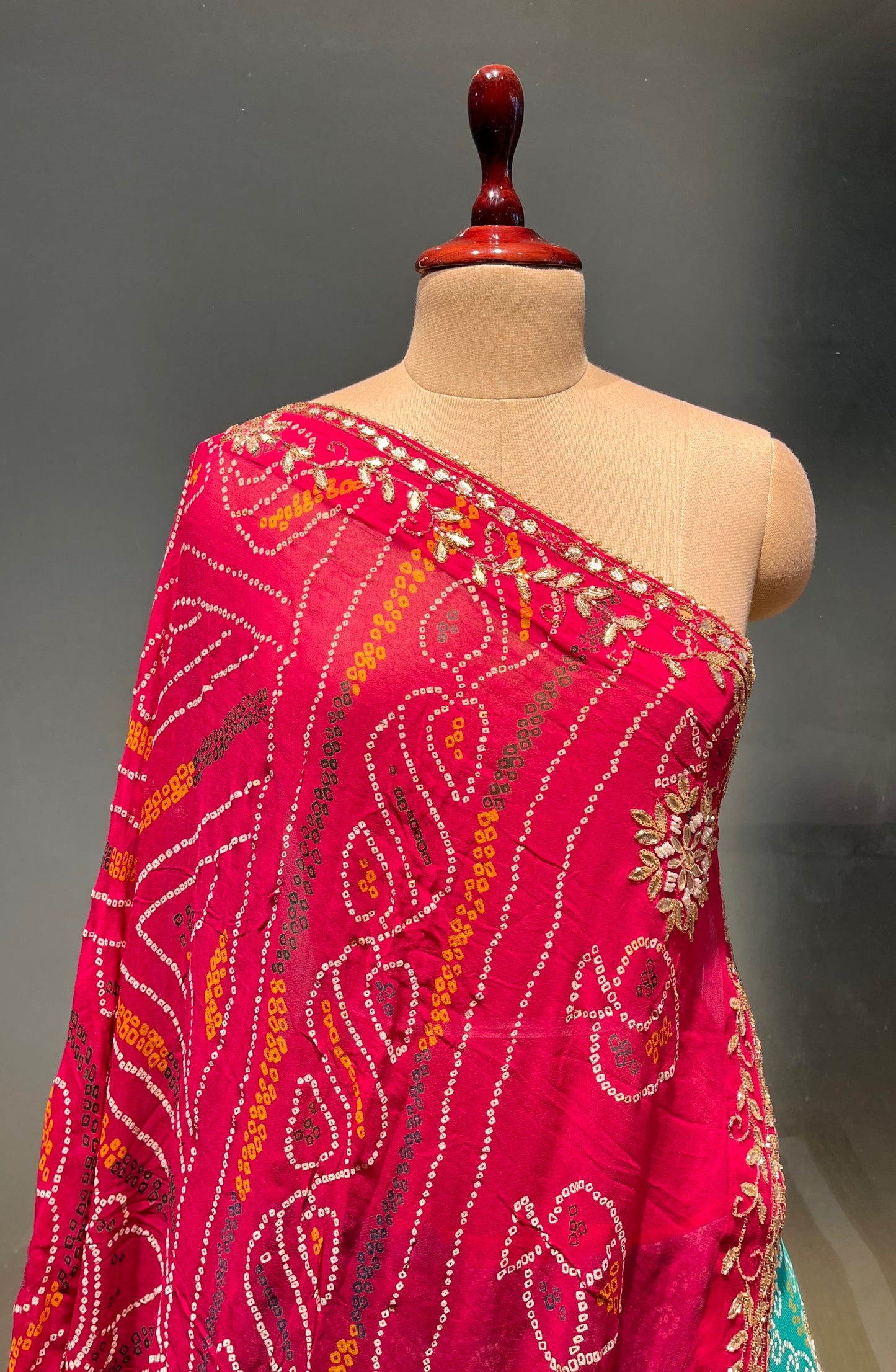 ( DELIVERY IN 20-25 DAYS ) TURQUOISE COLOUE GEORGETTE BANDHANI LEHENGA WITH UNSTITCHED BLOUSE EMBELLISHED WITH CUTDANA & GOTA PATTI WORK