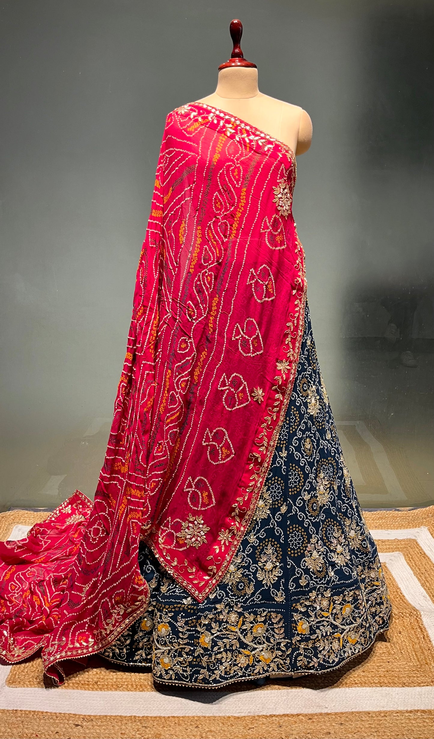( DELIVERY IN 20-25 DAYS ) BLUE COLOUR BANDHEJ GEORGETTE LEHENGA WITH UNSTITCHED BLOUSE EMBELLISHED WITH GOTA PATTI & CUTDANA WORK
