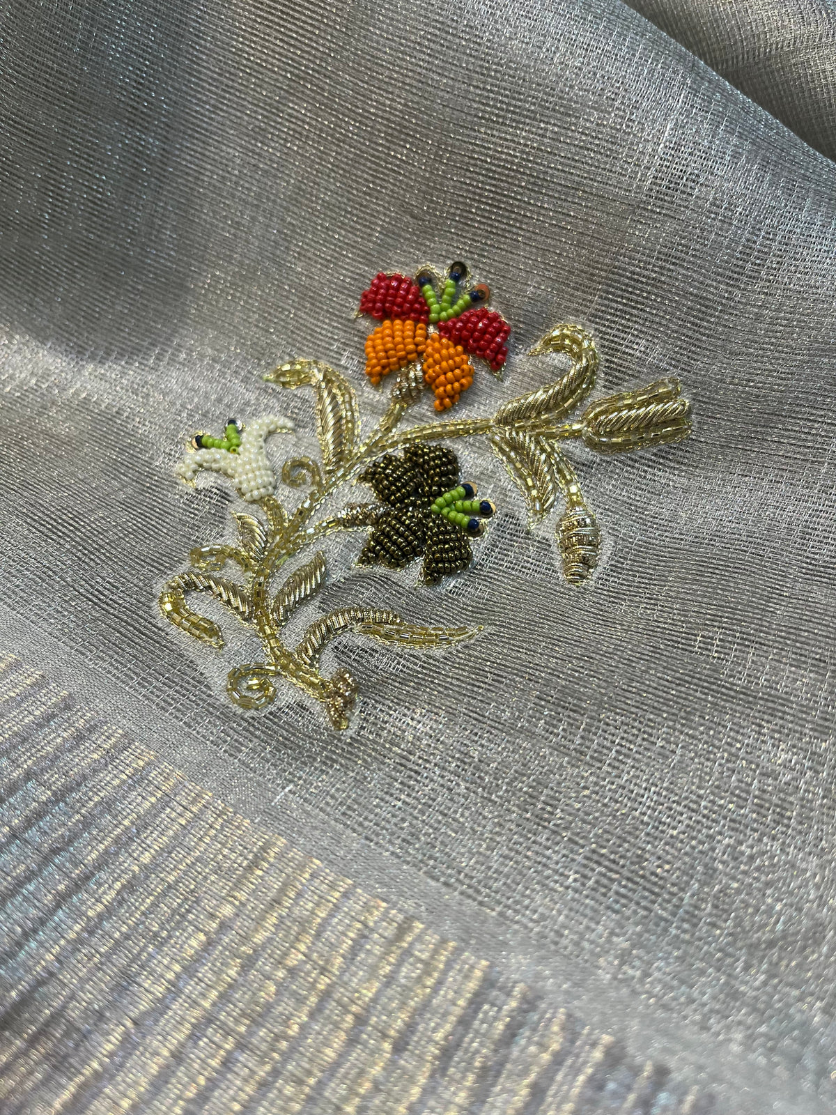 MACLENO WEAVE SILVER SAREE WITH BEADS AND ZARDOZI WORK