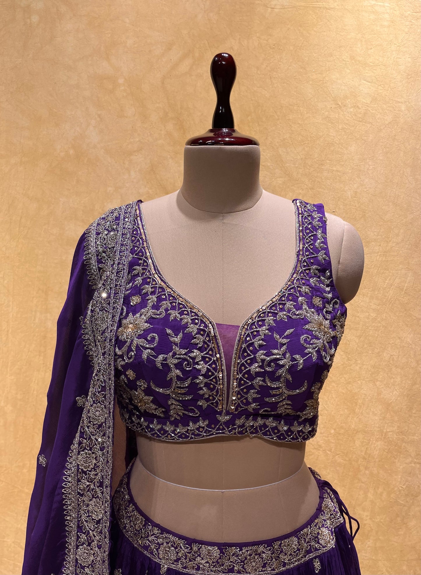 (DELIVERY IN 25 DAYS) PURPLE COLOUR CHINON EMBROIDERED LEHENGA WITH CROP TOP BLOUSE EMBELLISHED WITH CUTDANA & ZARI WORK