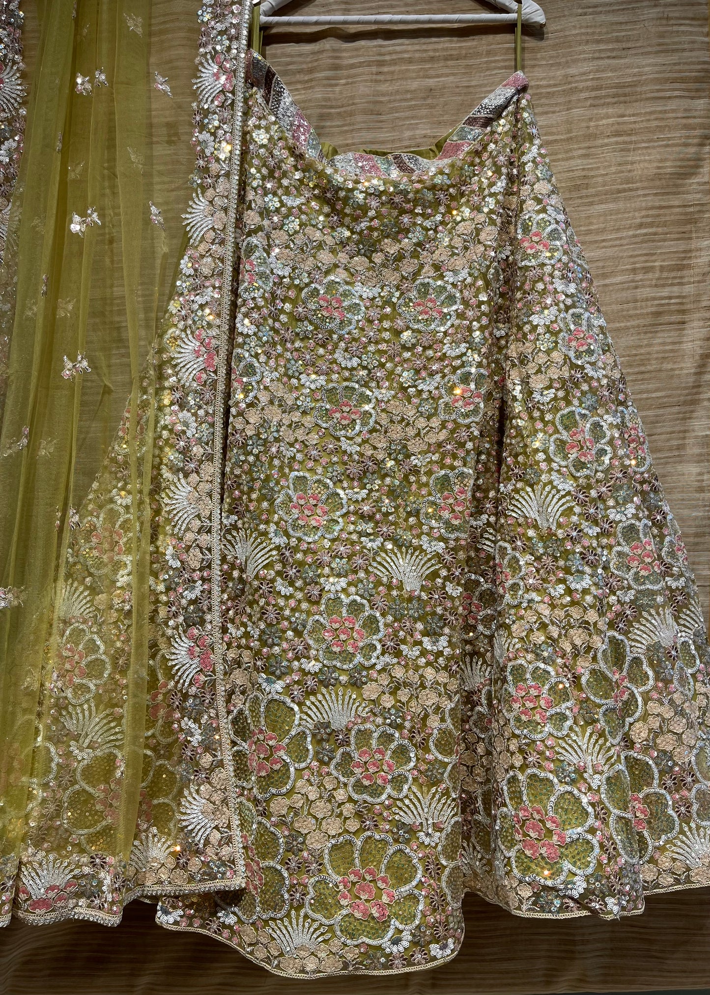5.5 METER FLARED PASTEL GREEN COLOUR NET MULTI COLOUR SEQUINS EMBROIDERED LEHENGA WITH UNSTITCHED BLOUSE