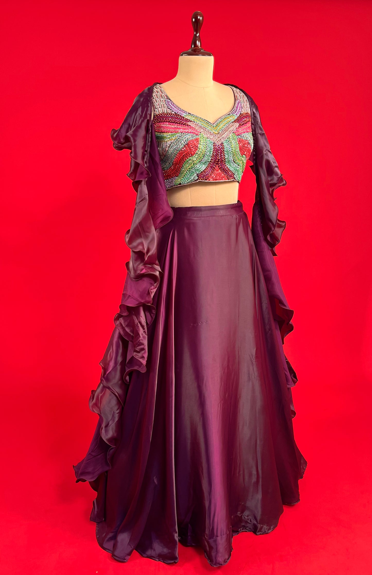 WINE COLOUR SATIN SKIRT WITH EMBROIDERED CROP TOP & RUFFLE DUPATTA EMBELLISHED WITH CUTDANA WORK