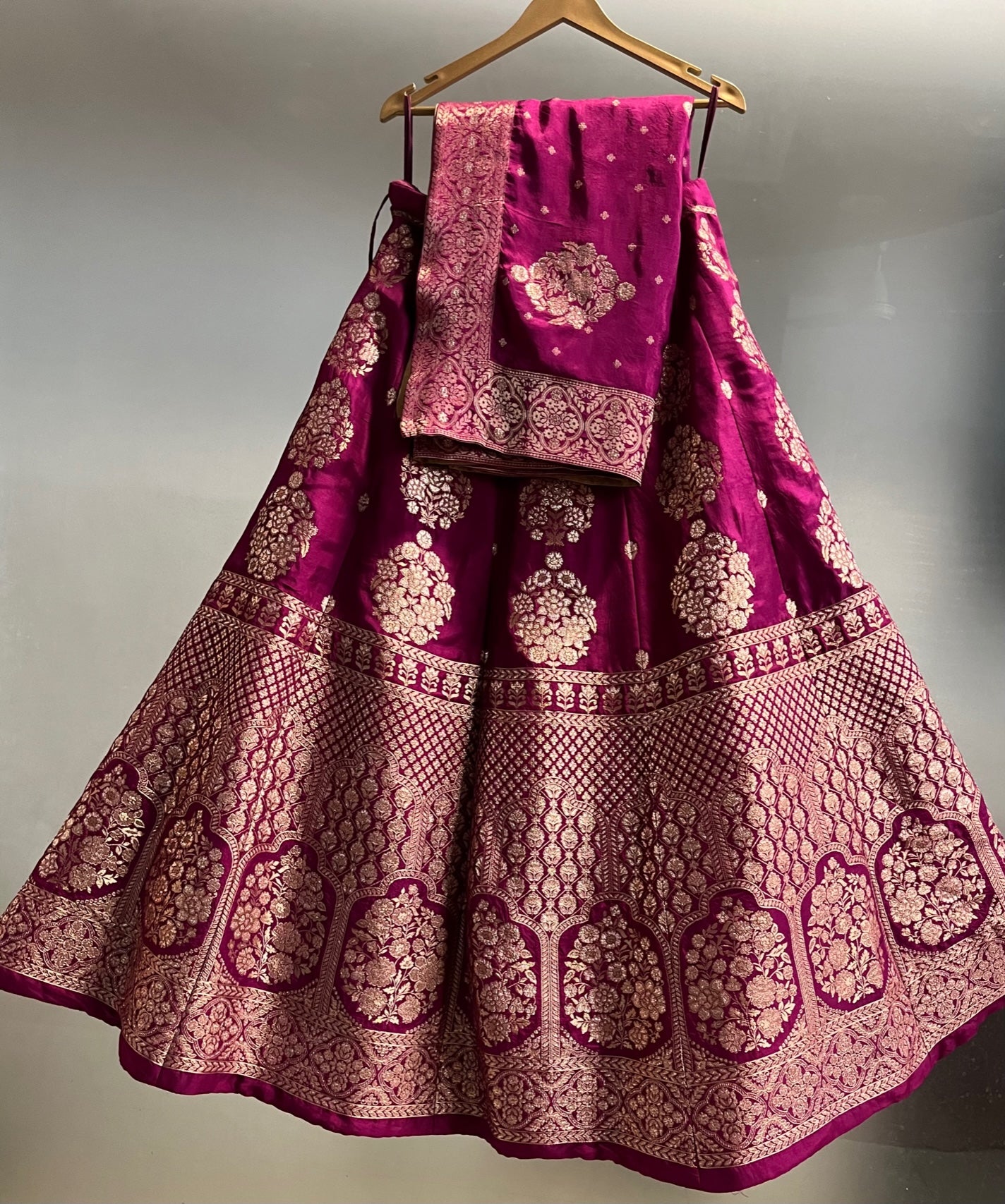 ( DELIVERY IN 25 DAYS ) WINE COLOUR BANARASI PURE SILK LEHENGA WITH UNSTITCHED BLOUSE EMBELLISHED WITH ZARI WEAVES