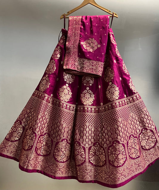 ( DELIVERY IN 25 DAYS ) WINE COLOUR BANARASI PURE SILK LEHENGA WITH UNSTITCHED BLOUSE EMBELLISHED WITH ZARI WEAVES