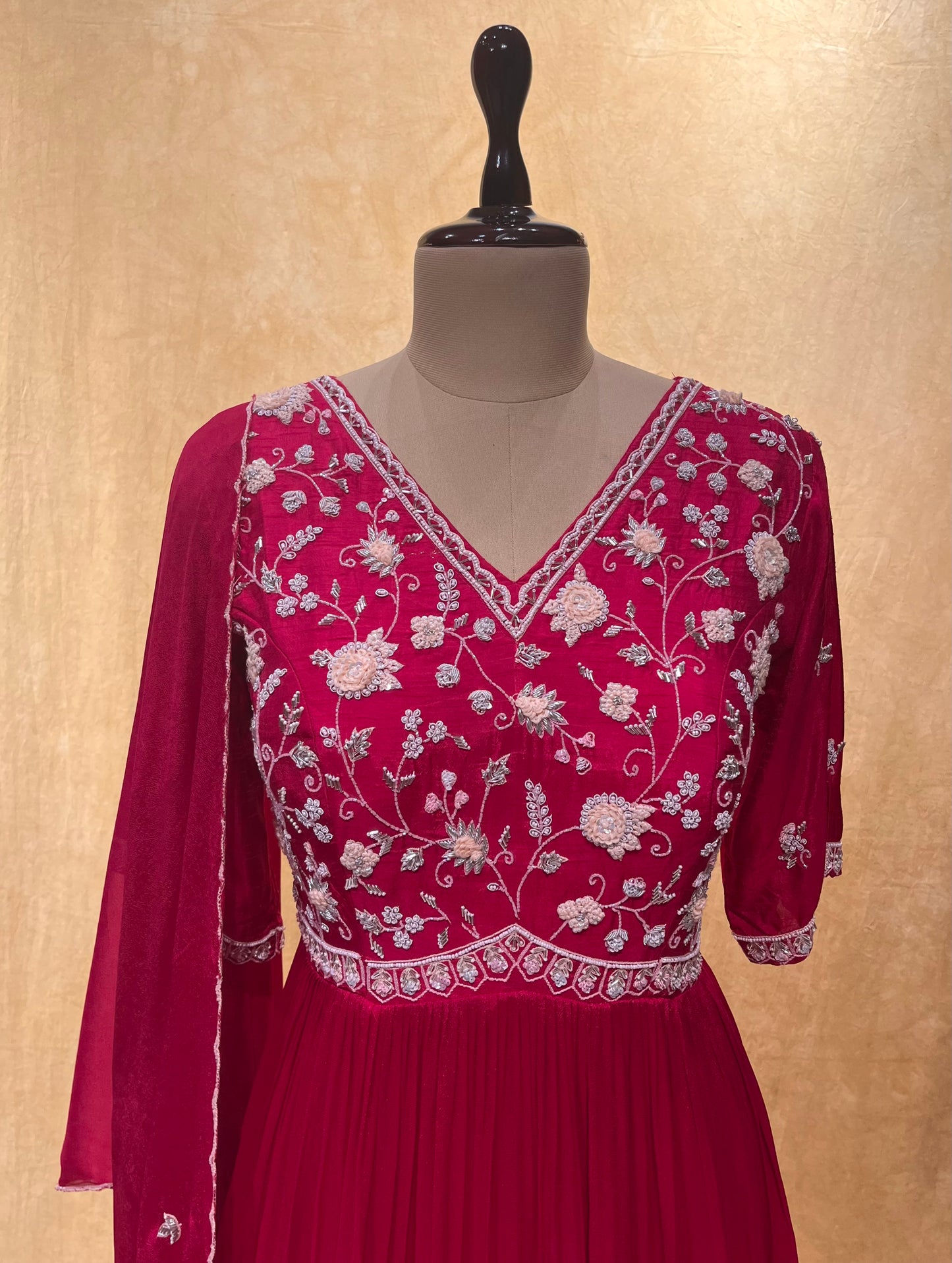 RANI COLOR CREPE SILK ANARKALI EMBROIDERED SUIT EMBELLISHED WITH CUTDANA & BEADS WORK