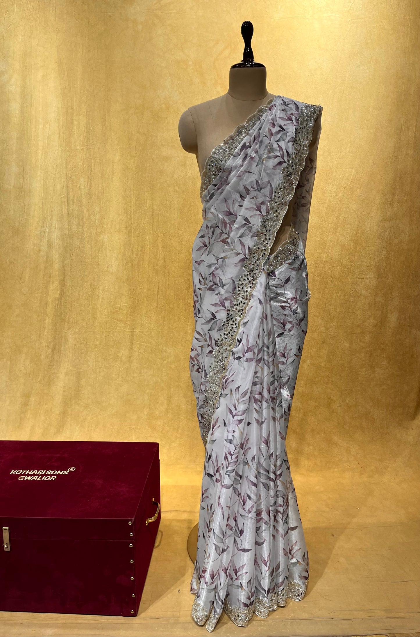 WHITE COLOR ORGANZA SCALLOPED BORDER SAREE EMBELLISHED WITH CUTDANA & MIRROR WORK