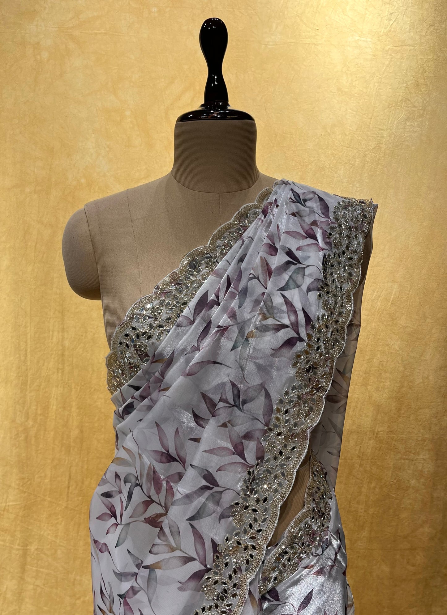 WHITE COLOR ORGANZA SCALLOPED BORDER SAREE EMBELLISHED WITH CUTDANA & MIRROR WORK