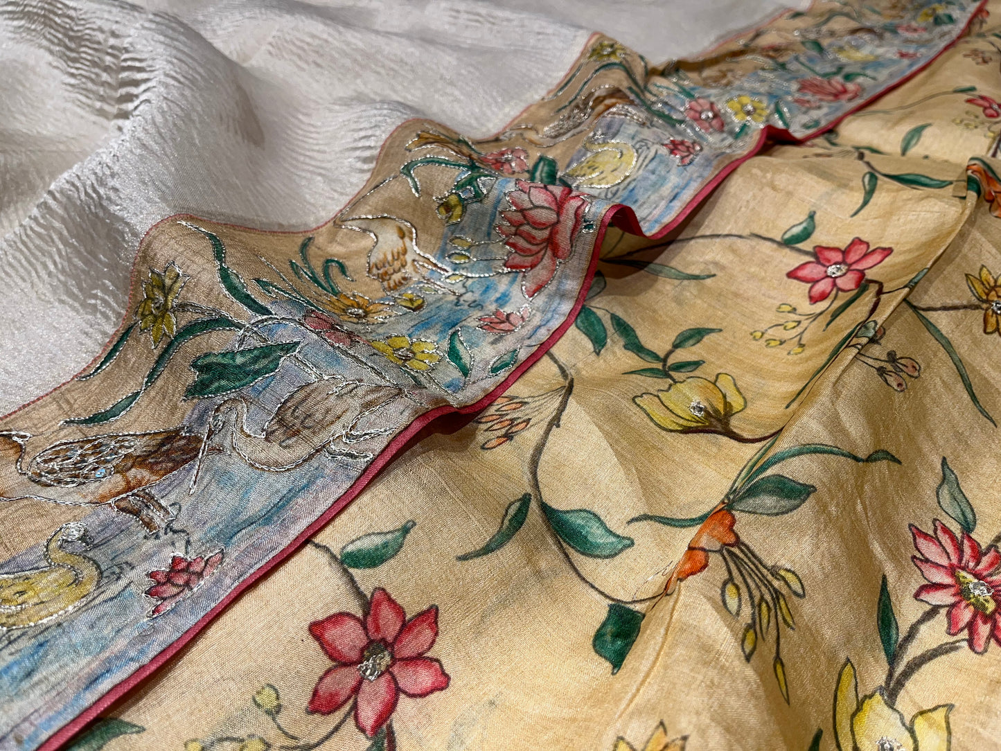OFF WHITE COLOR CRUSHED TISSUE SAREE WITH TUSSAR SILK BLOUSE EMBELLISHED EITH AARI & BIRDS BORDER