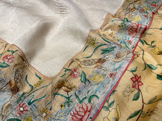 OFF WHITE COLOR CRUSHED TISSUE SAREE WITH TUSSAR SILK BLOUSE EMBELLISHED EITH AARI & BIRDS BORDER