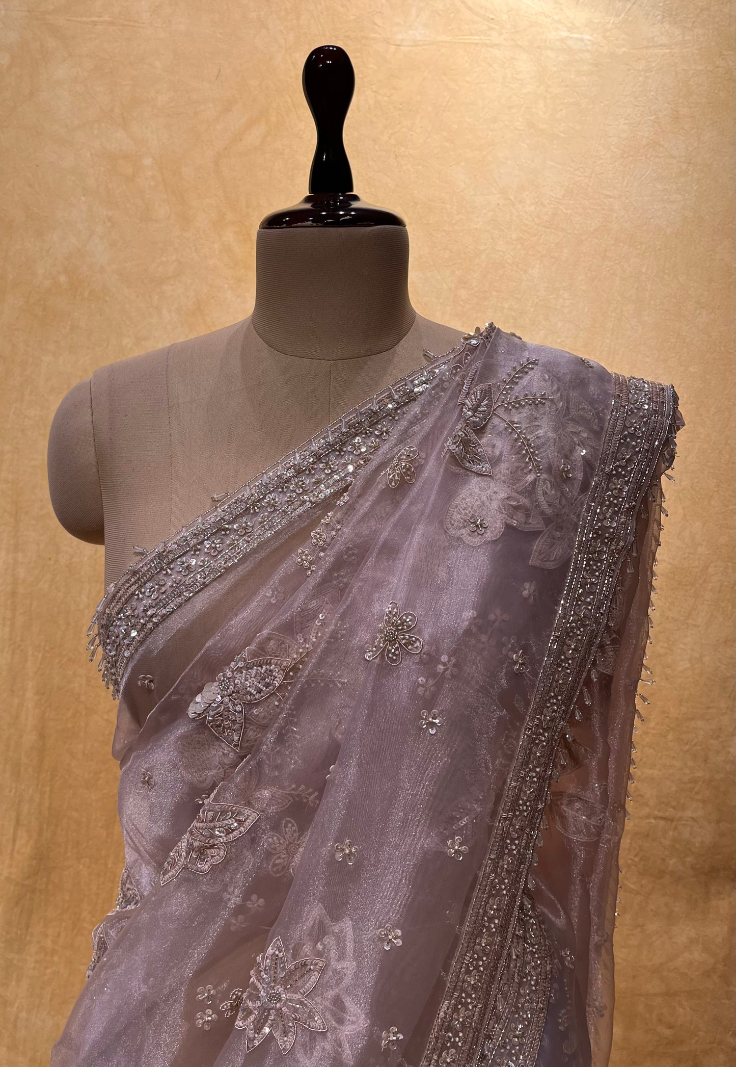 PASTEL PEACH COLOUR ORGANZA TISSUE HAND EMBROIDERED SAREE EMBELLISHED WITH CUTDANA, SEQUINS & ZARDOZI WORK