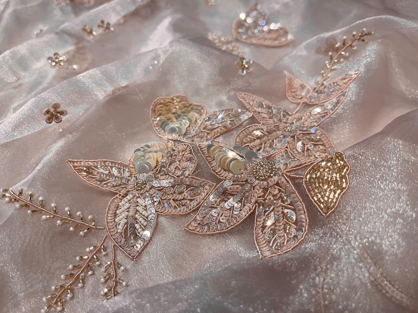 PASTEL PEACH COLOUR ORGANZA TISSUE HAND EMBROIDERED SAREE EMBELLISHED WITH CUTDANA, SEQUINS & ZARDOZI WORK
