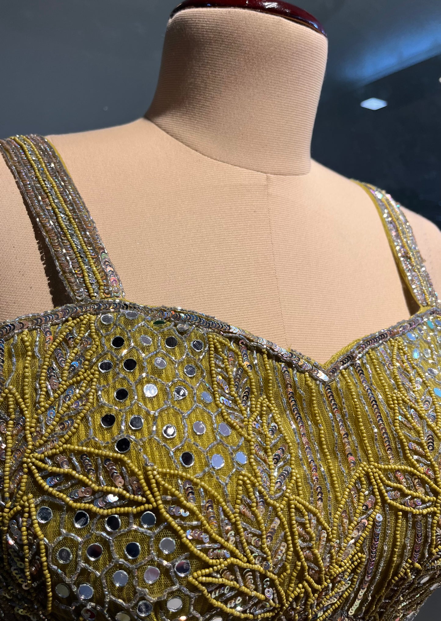 MEHANDI GREEN COLOUR PLEATED LYCRA SKIRT WITH CROP TOP & RUFFLE DUPATTA EMBELLISHED WITH MIRROR & BEADS WORK