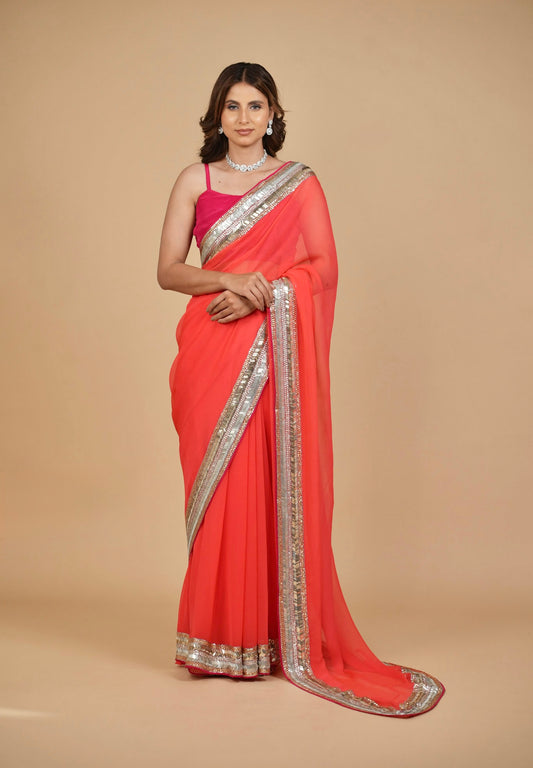 CORAL COLOUR PURE PLATINUM CHIFFON SAREE WITH DELICATE AND RICH SEQUINS BORDER