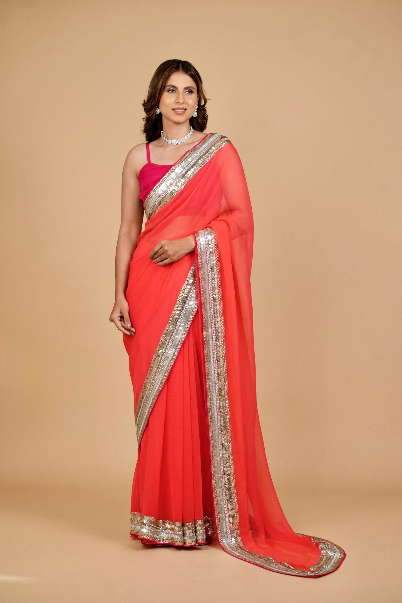 CORAL COLOUR PURE PLATINUM CHIFFON SAREE WITH DELICATE AND RICH SEQUINS BORDER