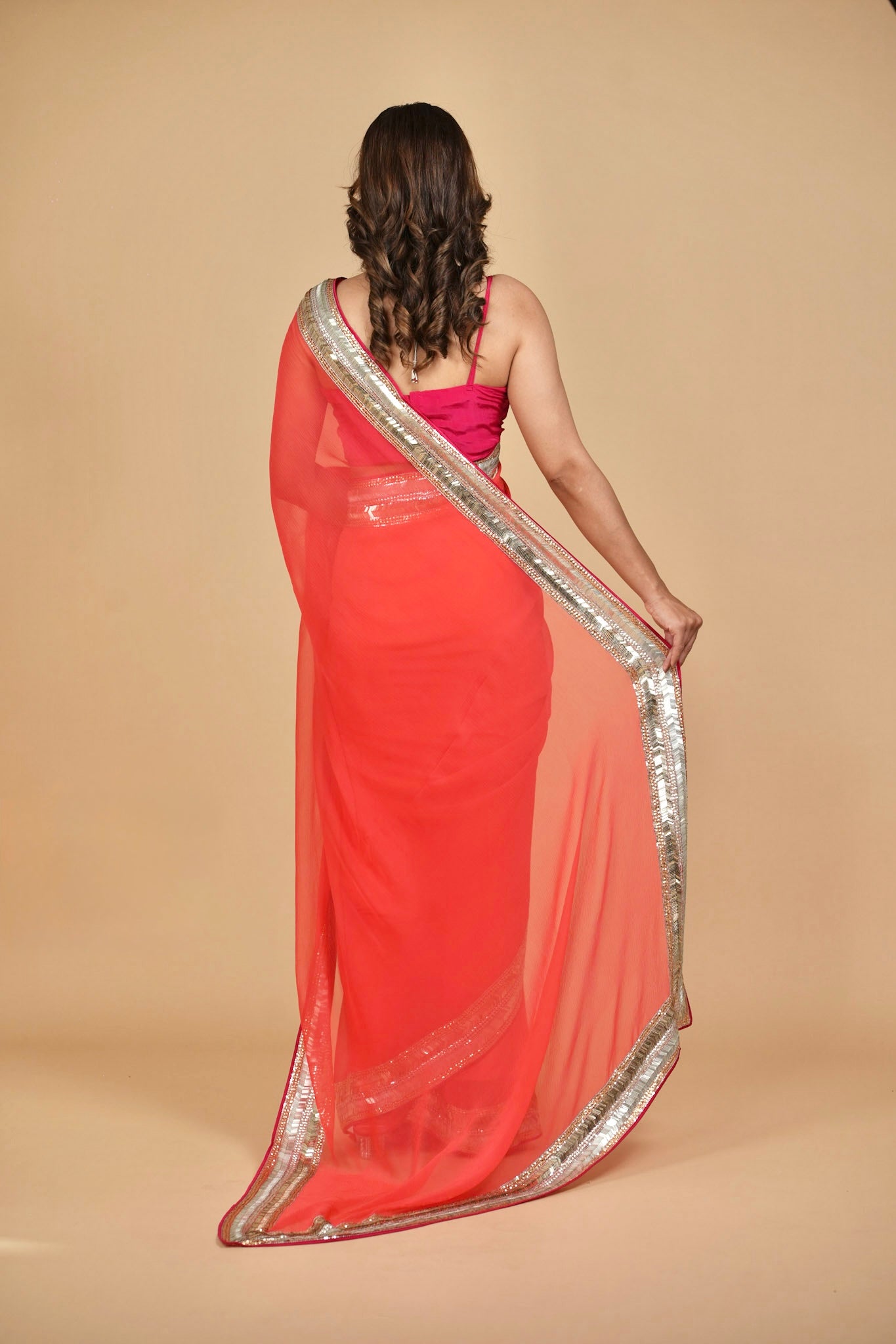 CORAL COLOUR PURE PLATINUM CHIFFON SAREE WITH DELICATE AND RICH SEQUINS BORDER
