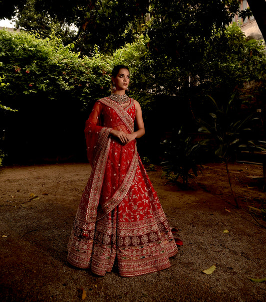 ( DELIVERY IN 50 DAYS ) RED COLOUR BRIDAL HAND EMBROIDERED LEHENGA WITH UNSTITCHED BLOUSE & NET DUPATTA EMBELLISHED WITH ZARDOZI & BEADS WORK