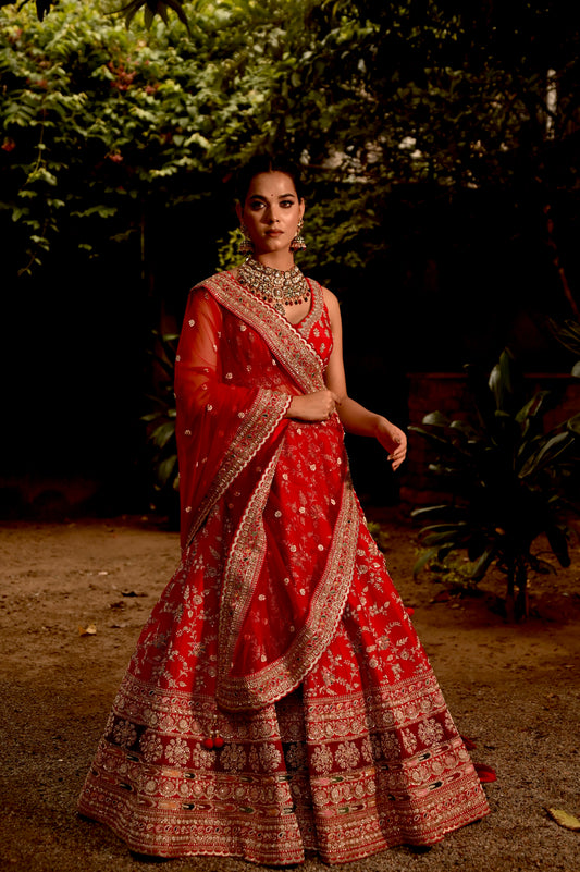 ( DELIVERY IN 50 DAYS ) RED COLOUR BRIDAL HAND EMBROIDERED LEHENGA WITH UNSTITCHED BLOUSE & NET DUPATTA EMBELLISHED WITH ZARDOZI & BEADS WORK