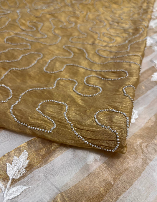 IVORY COLOUR CHANDERI GOLDEN STRIPED PARSI EMBROIDERED SAREE PAIRED WITH AN UNSTITCHED GOLDEN BLOUSE BY SIDDHAIKA - Kothari Sons