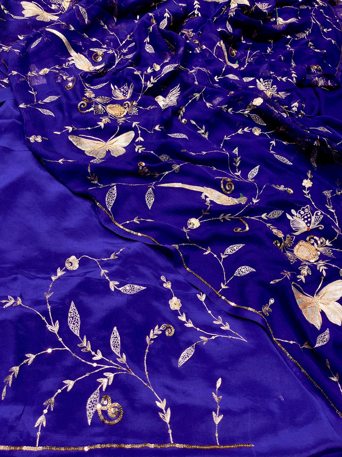 ( DELIVERY IN 30 DAYS ) BLUE COLOUR PURE CHIFFON HAND EMBROIDERED SAREE EMBELLISHED WITH SEQUINS ZARI & ZARDOZI WORK