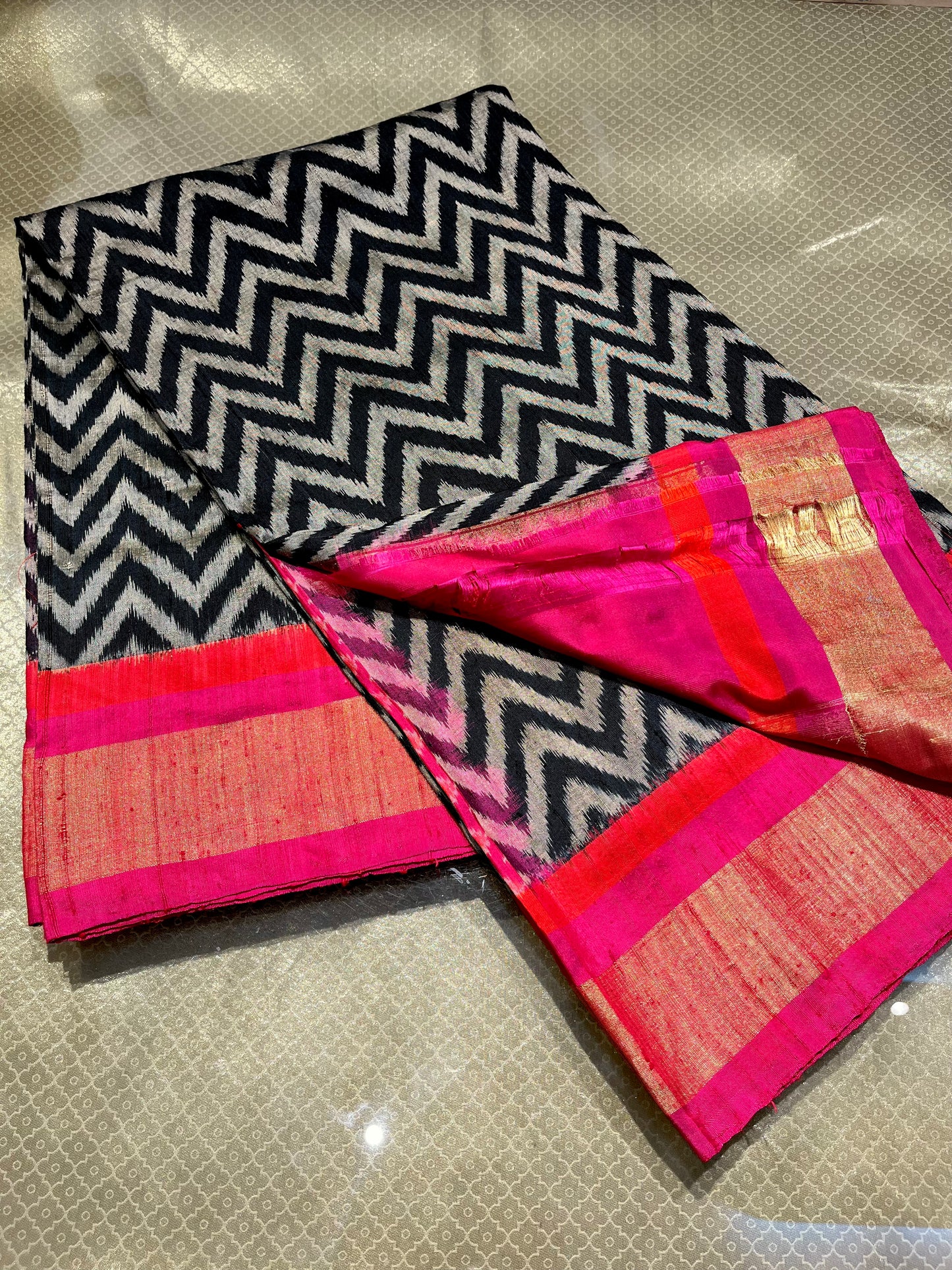 BLACK & WHITE COLOUR LINEN SILK IKAT PSTOLA SAREE EMBELLISHED WITH ZARI BORDER