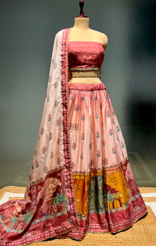 PEACH COLOUR PRINTED SILK LEHENGA WITH UNSTITCHED BLOUSE EMBELLISHED WITH CUTDANA WORK