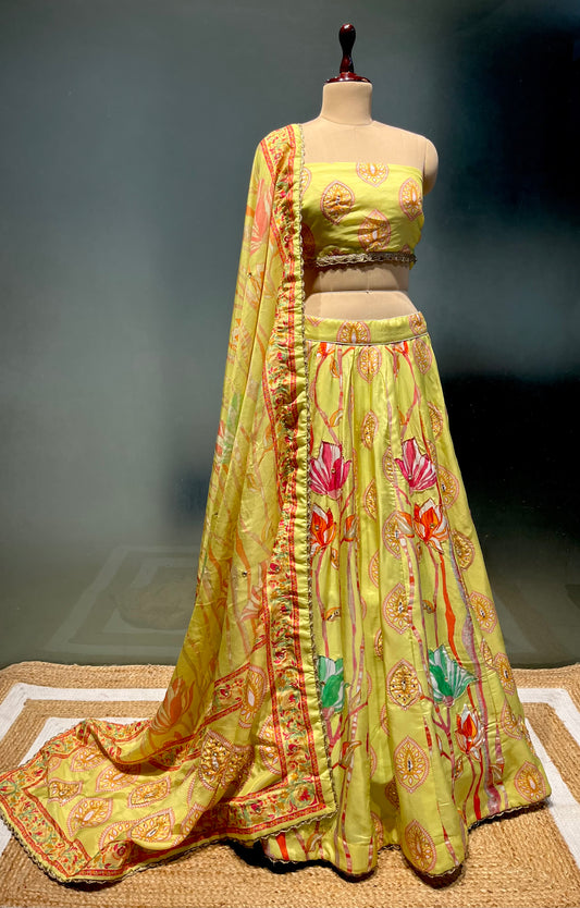 PISTA GREEN COLOUR PRINTED SILK LEHENGA WITH UNSTITCHED BLOUSE EMBELLISHED WITH CUTDANA & SEQUINS WORK