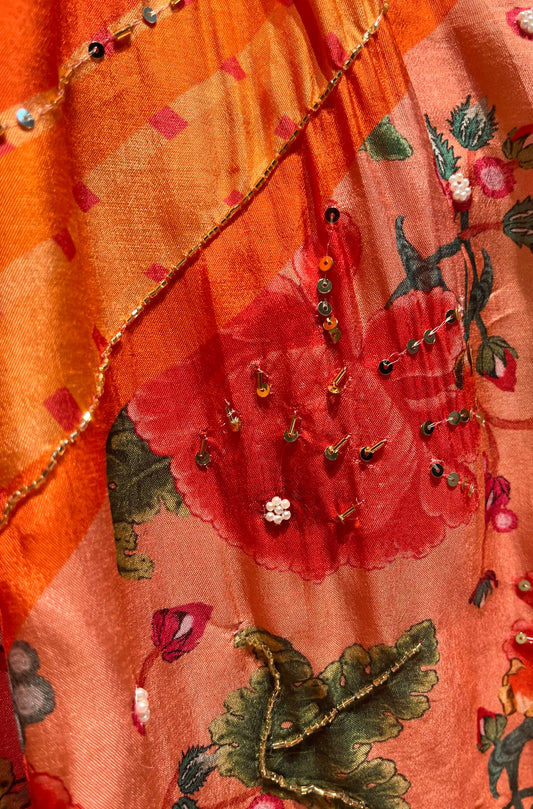 ORANGE COLOUR PRINTED SILK LEHENGA WITH UNSTITCHED BLOUSE EMBELLISHED WITH CUTDANA & SEQUINS WORK