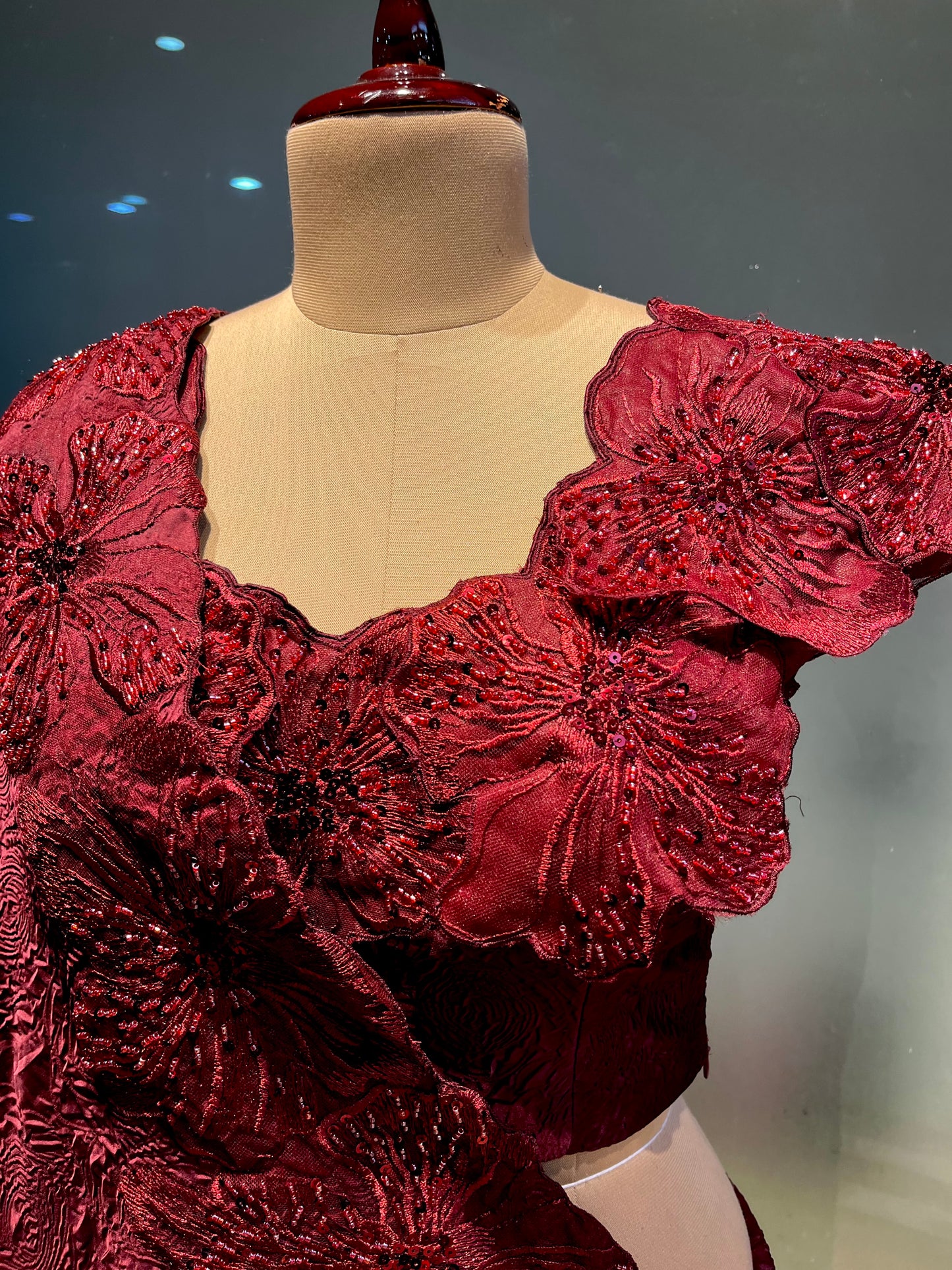 MAROON COLOUR SATIN EMBOSSED PRINT SAREE WITH READYMADE BLOUSE EMBELLISHED WITH FLORAL APPLIQUE WORK BORDER