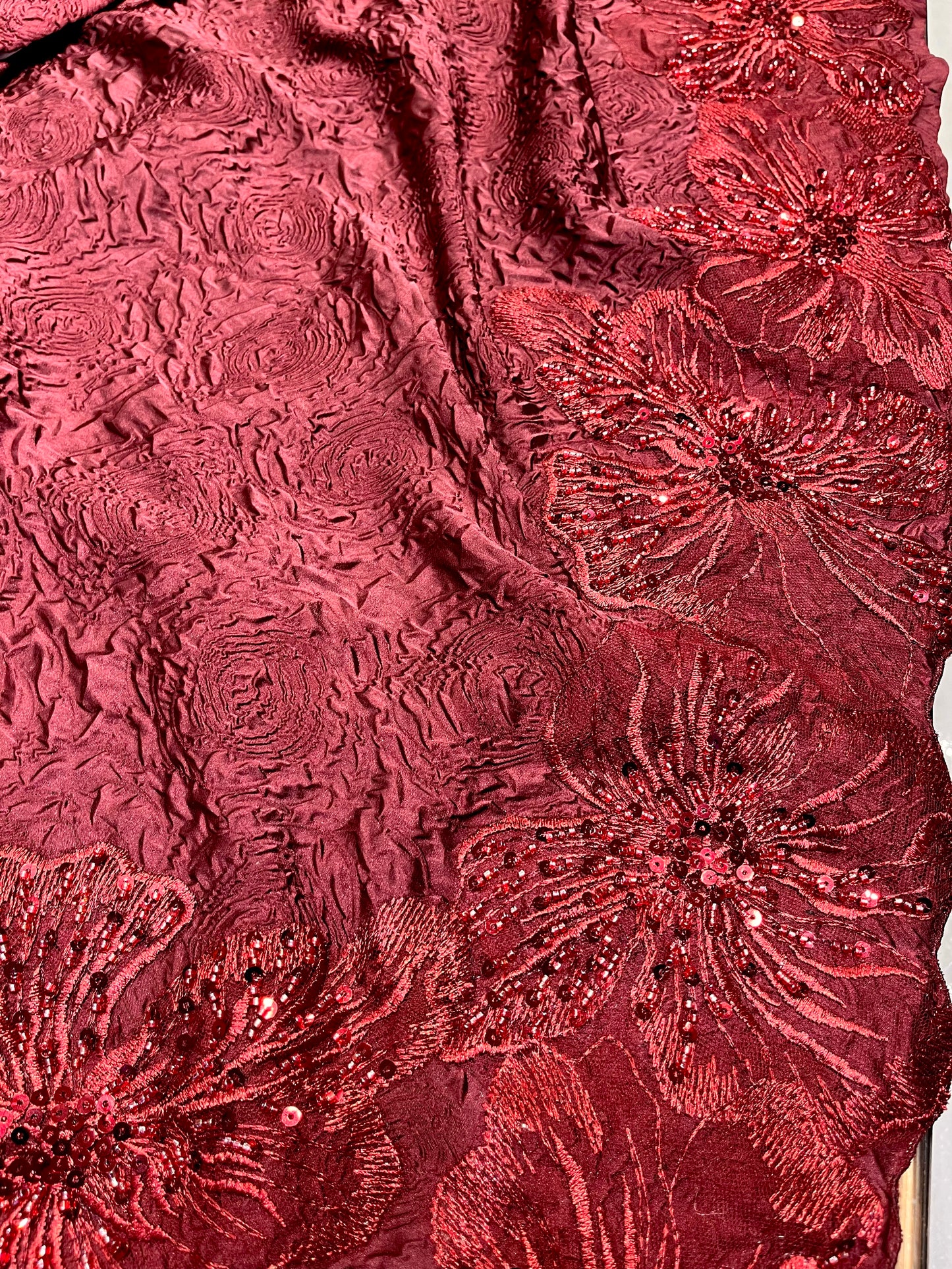MAROON COLOUR SATIN EMBOSSED PRINT SAREE WITH READYMADE BLOUSE EMBELLISHED WITH FLORAL APPLIQUE WORK BORDER