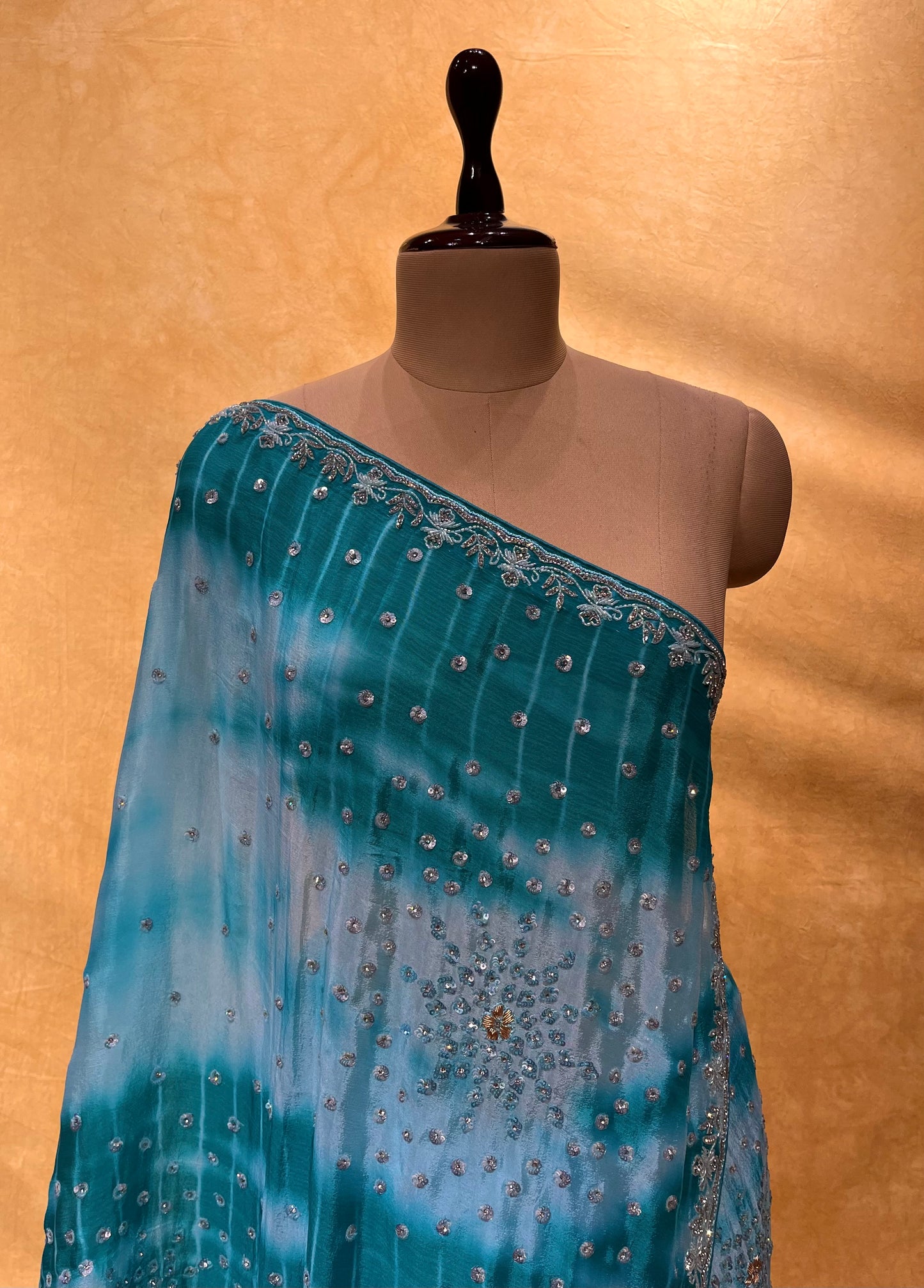WHITE & TURQUOISE COLOUR SHIBORI PRINT CHINON EMBROIDERED SAREE EMBELLISHED WITH SEQUINS, CUTDANA & STONE WORK