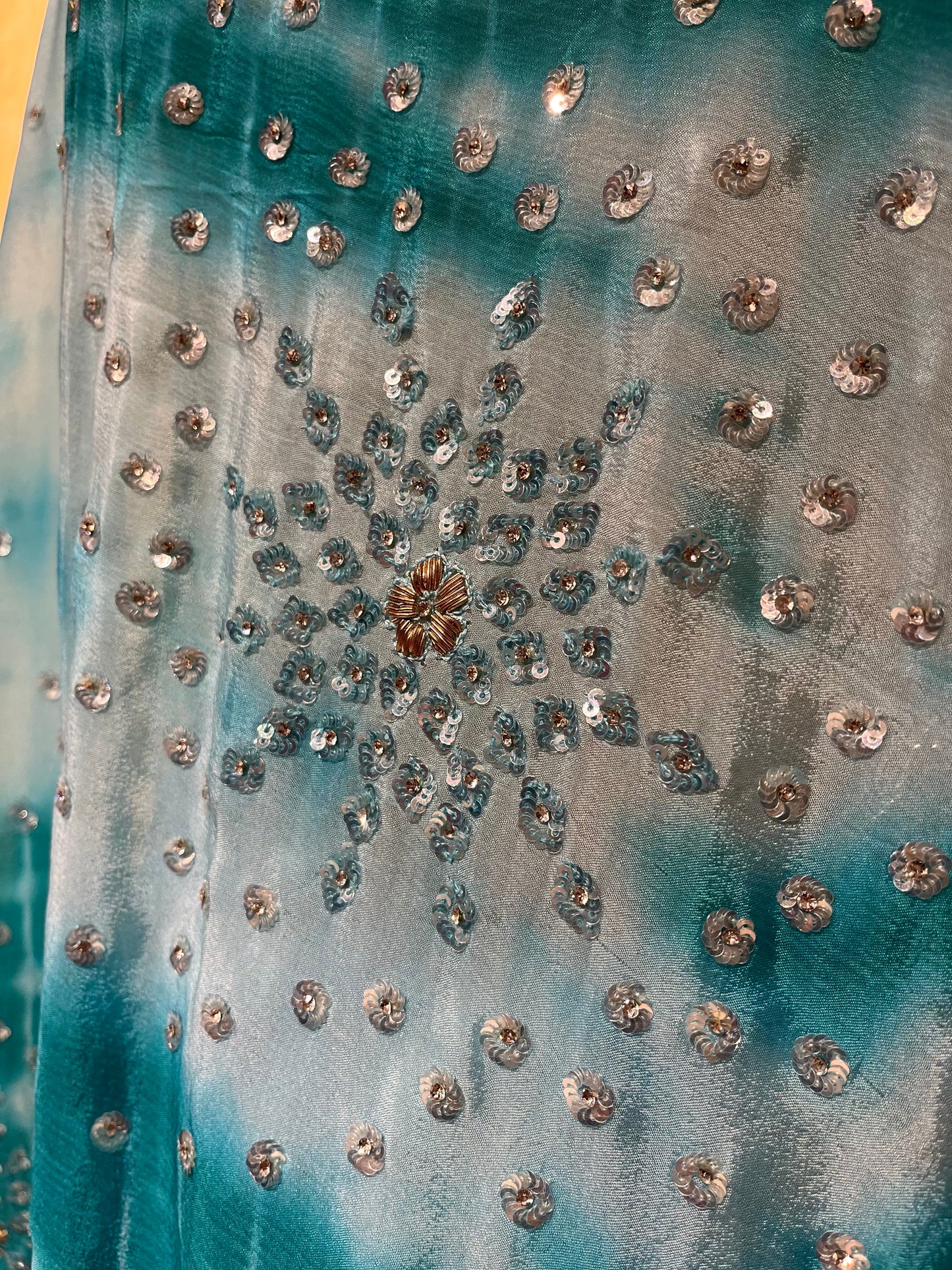 WHITE & TURQUOISE COLOUR SHIBORI PRINT CHINON EMBROIDERED SAREE EMBELLISHED WITH SEQUINS, CUTDANA & STONE WORK