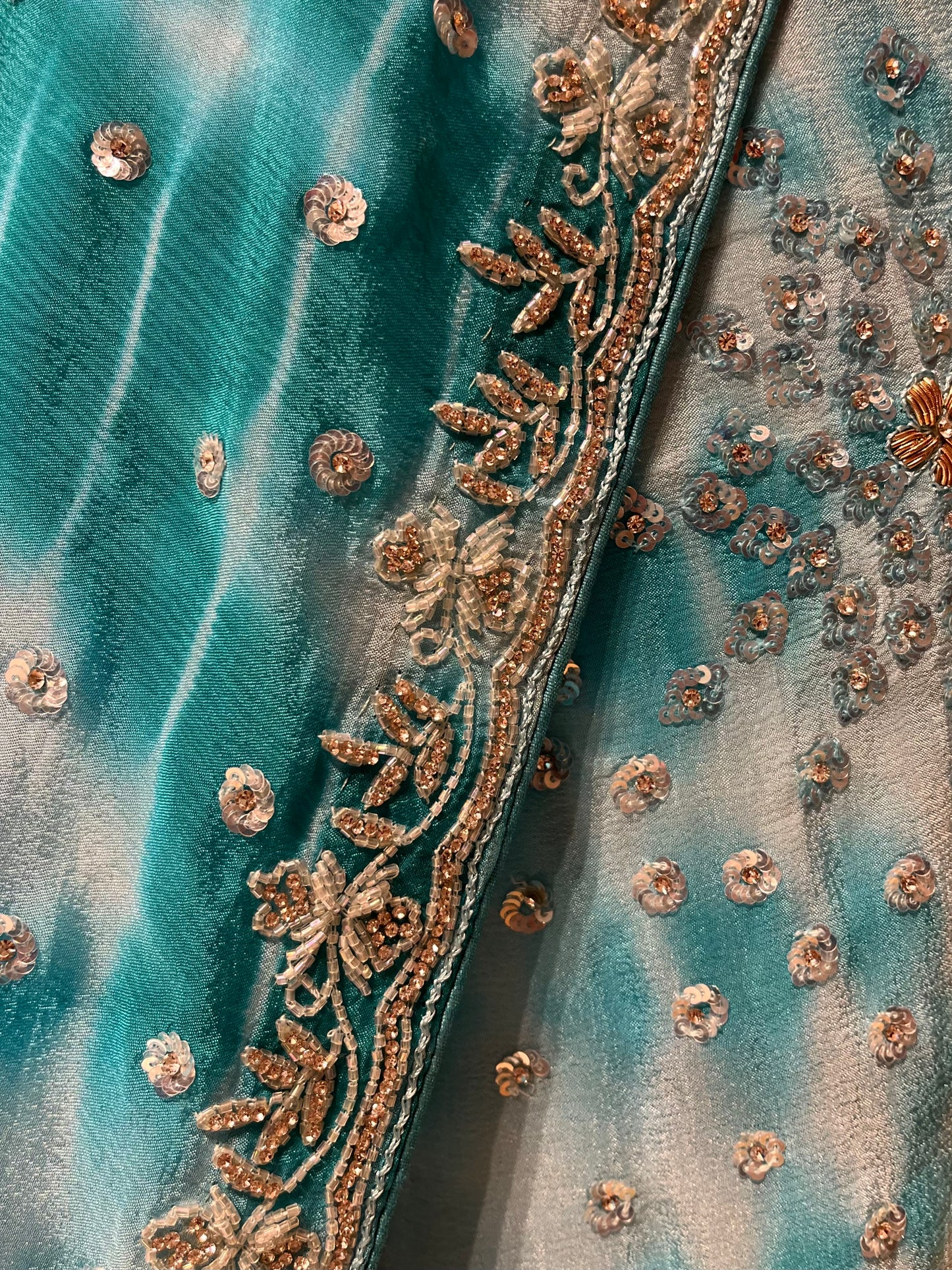 WHITE & TURQUOISE COLOUR SHIBORI PRINT CHINON EMBROIDERED SAREE EMBELLISHED WITH SEQUINS, CUTDANA & STONE WORK
