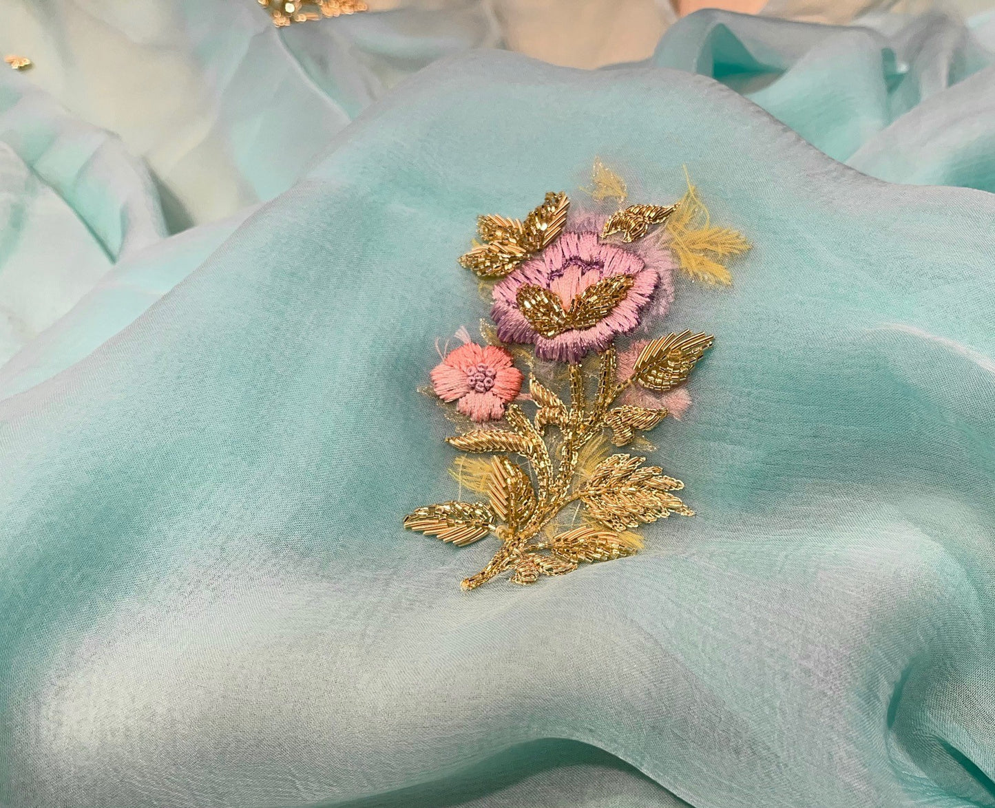 ( DELIVERY IN 25 DAYS ) AQUA COLOUR CHIFFON HAND EMBROIDERED SAREE EMBELLISHED WITH RESHAM, CUTDANA & ZARDOSI WORK