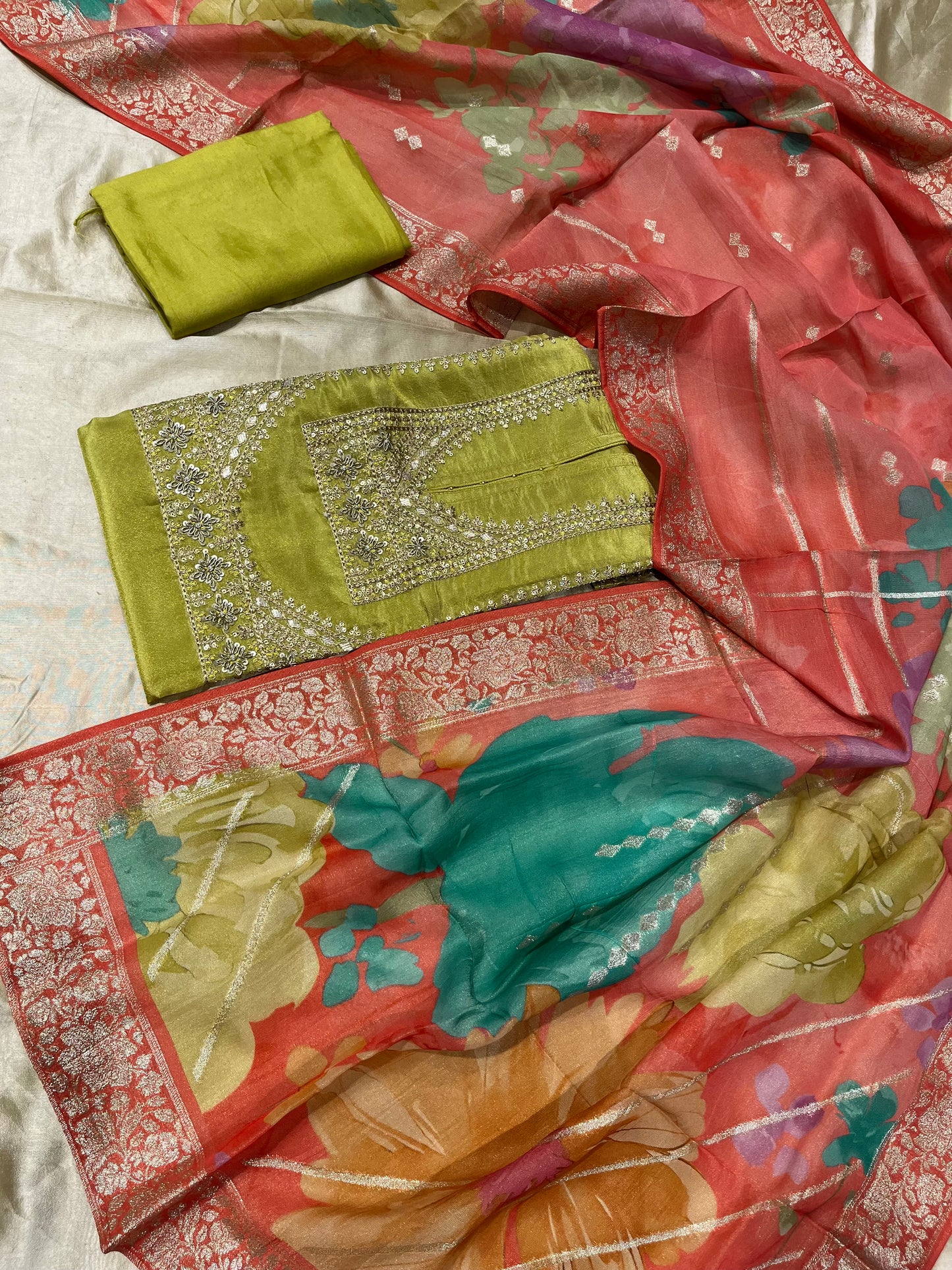 GREEN COLOUR CREPE TISSUE UNSTITCHED SUIT WITH ORGANZA DUPATTA EMBELLISHED WITH ZARDOZI & SEQUINS WORK