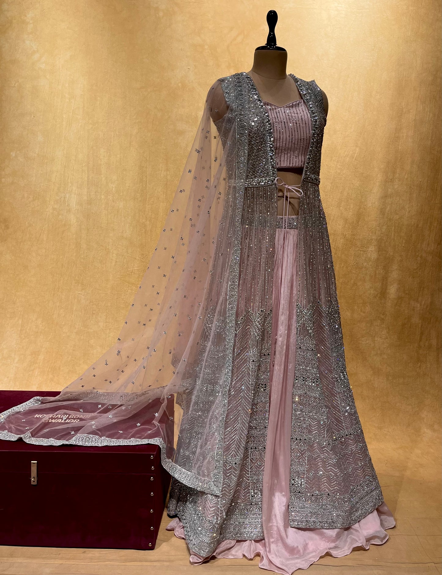 PINK COLOR NET EMBROIDERED SKIRT WITH CROP TOP BLOUSE, SHRUG & DUPATTA EMBELLISHED WITH ZARI & MIRROR WORK