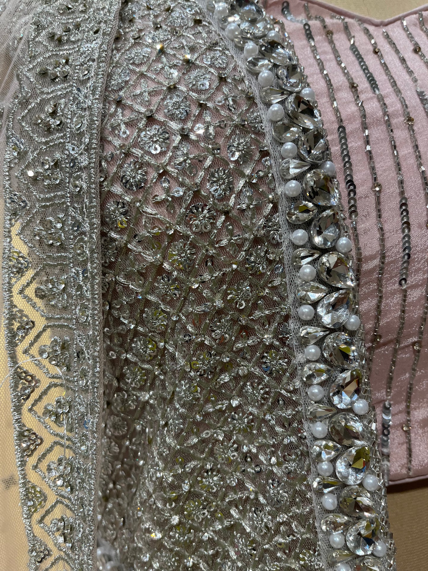 PINK COLOR NET EMBROIDERED SKIRT WITH CROP TOP BLOUSE, SHRUG & DUPATTA EMBELLISHED WITH ZARI & MIRROR WORK