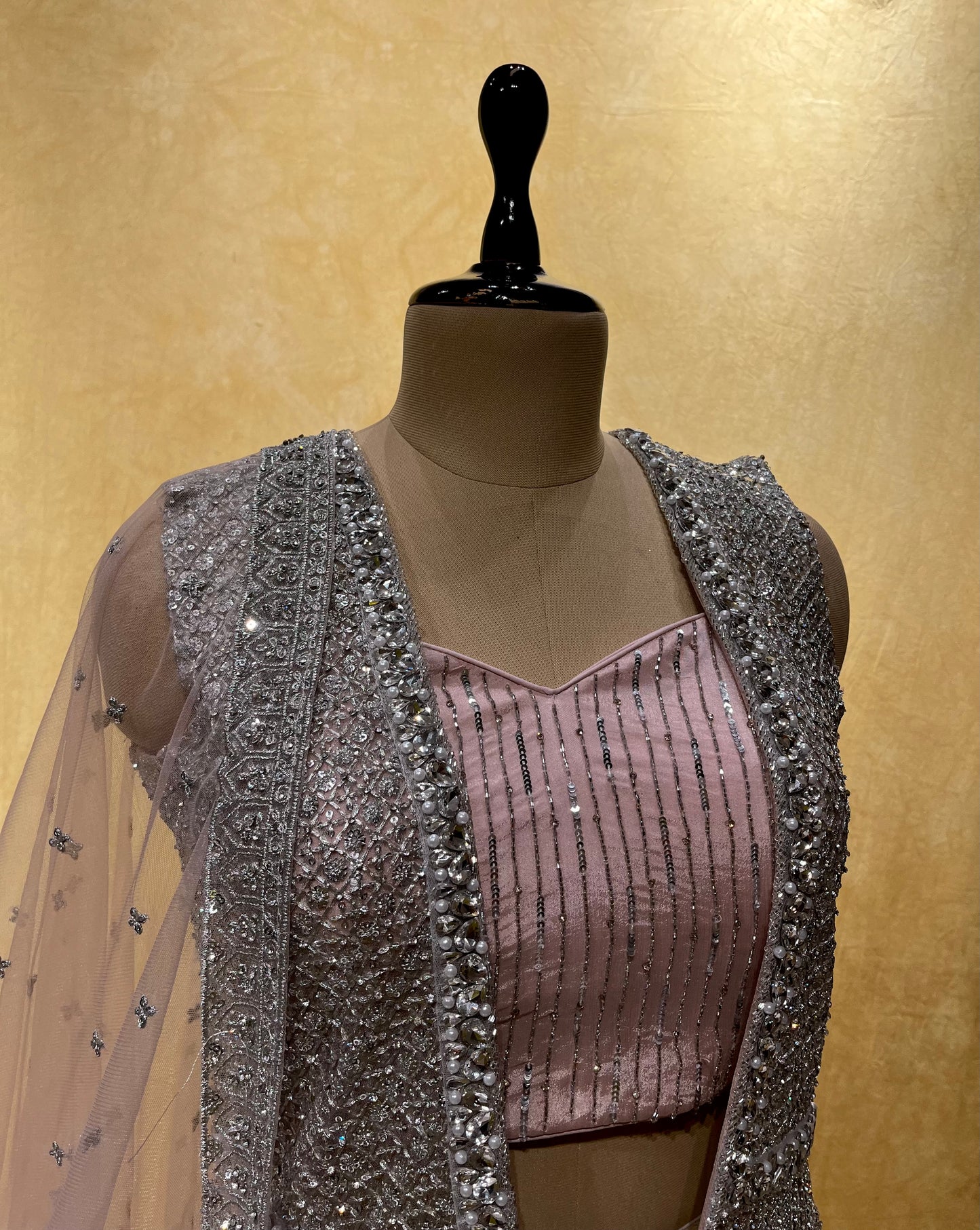 PINK COLOR NET EMBROIDERED SKIRT WITH CROP TOP BLOUSE, SHRUG & DUPATTA EMBELLISHED WITH ZARI & MIRROR WORK