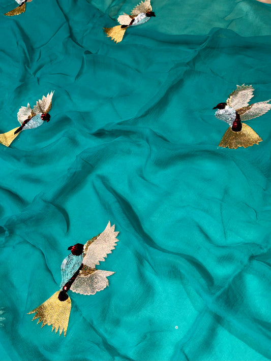 TURQUOISE COLOUR CHIFFON HAND EMBROIDERED SAREE EMBELLISHED WITH SEQUINS & AARI WORK