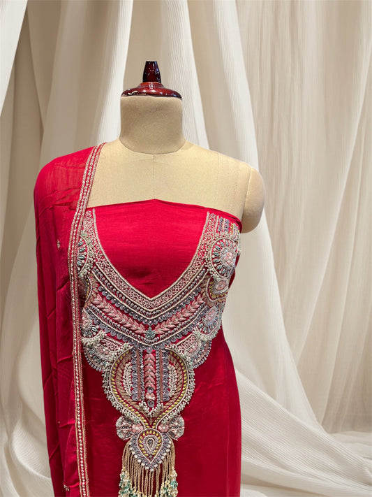 Red colour, linen satin unstitched suit with zardozi embroidery & emerald tassels