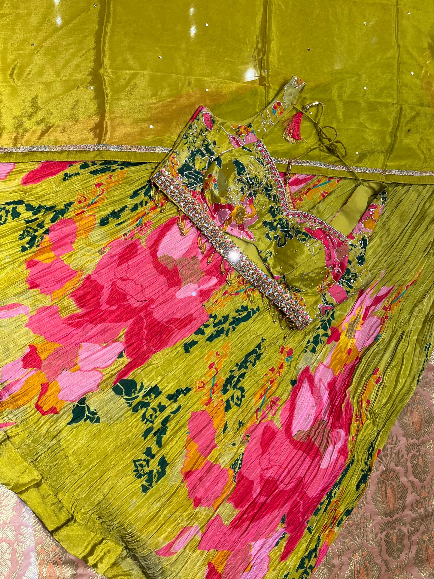 ( DELIVERY IN 15-20 DAYS ) PARROT GREEN COLOUR CREPE SILK SKIRT WITH READYMADE BLOUSE EMBELLISHED WITH CUTDANA WORK