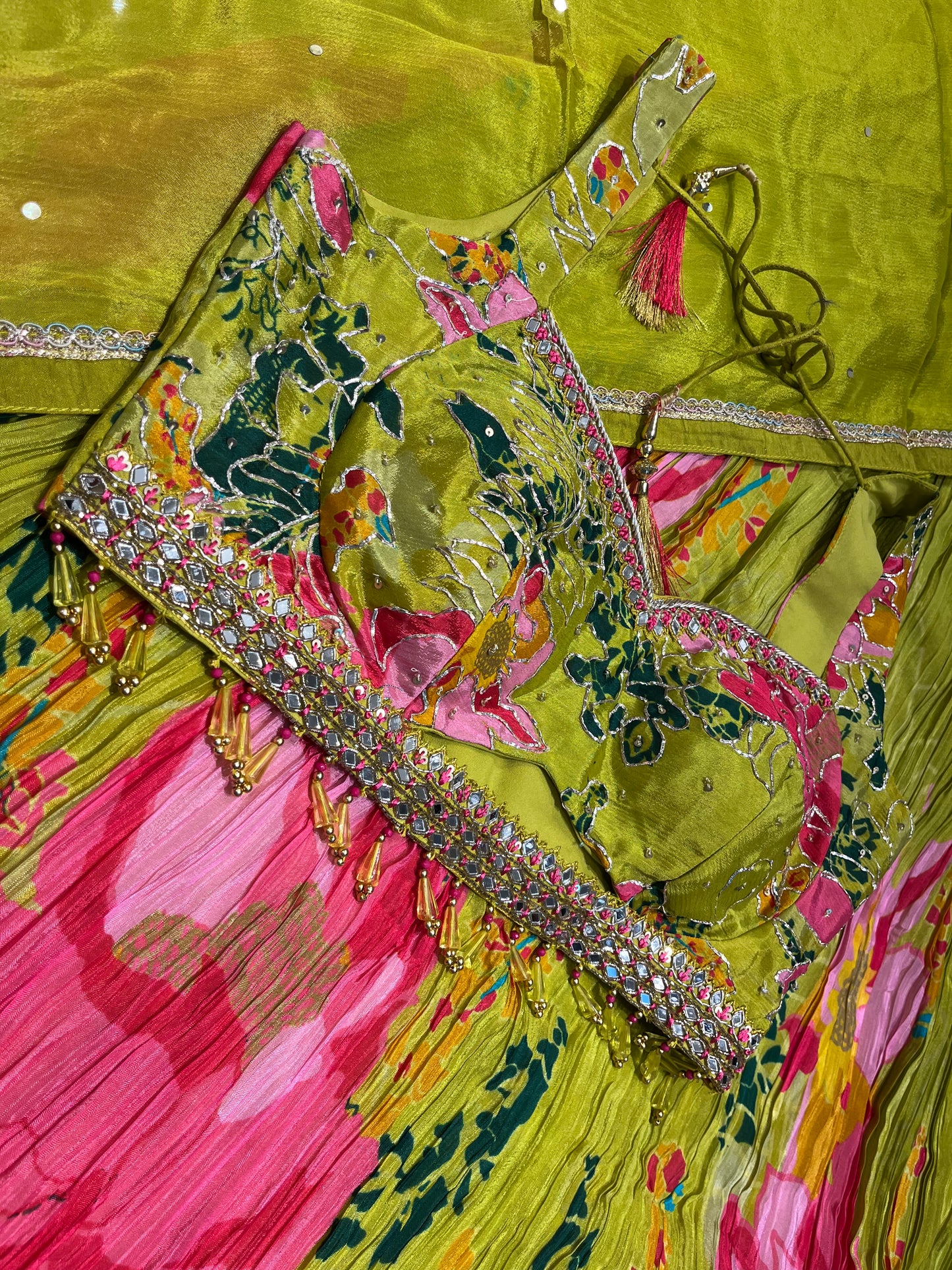 ( DELIVERY IN 15-20 DAYS ) PARROT GREEN COLOUR CREPE SILK SKIRT WITH READYMADE BLOUSE EMBELLISHED WITH CUTDANA WORK