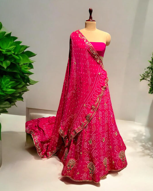 (Deliver in 30 Days) RANI PINK COLOUR GEORGETTE OJARIYA BANDHANI LEHENGA WITH UNSTITCHED BLOUSE EMBELLISHED WITH GOTA PATTI WORK