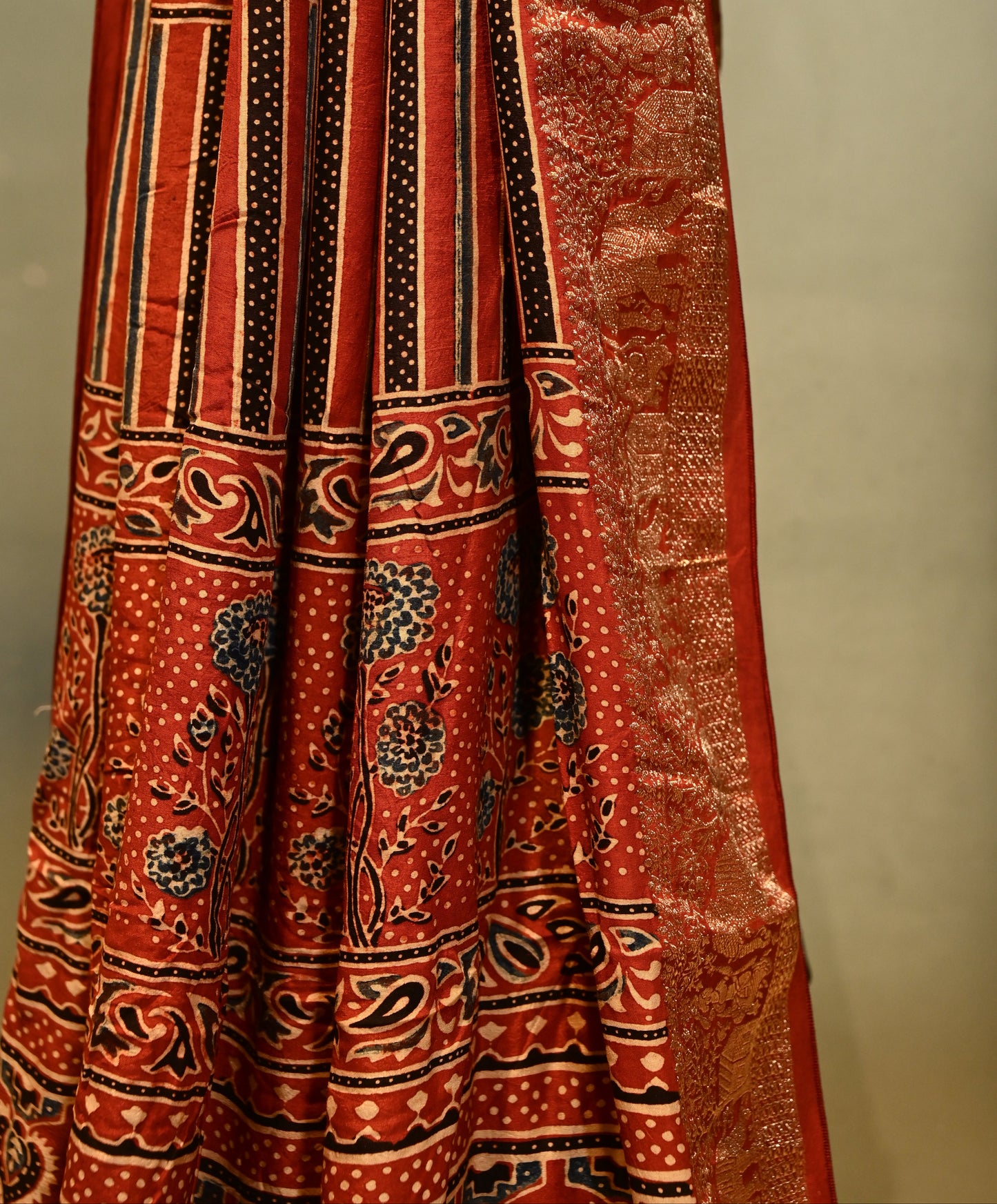 BLACK/RUST CONTRAST AJRAKH PRINT SAREE WITH RUST AJRAKH BLOUSE AND RICH BANARASI PALLA & BORDER IN PLANT-BASED SILK