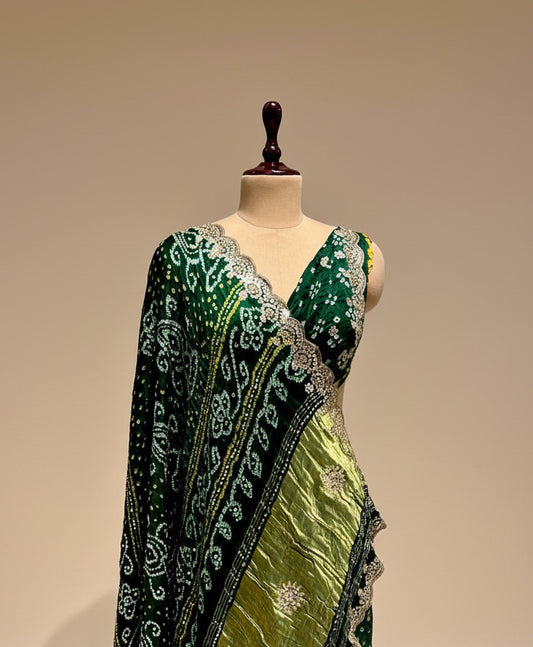 BOTTLE GREEN SATIN SILK BANDHANI SAREE WITH FOIL MIRROR WORK - Kothari Sons