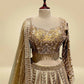 ANTIQUE GOLDEN TISSUE LEHENGA EMBELLISHED WITH SEQUINS, CUTDANA & RESHAM WORK