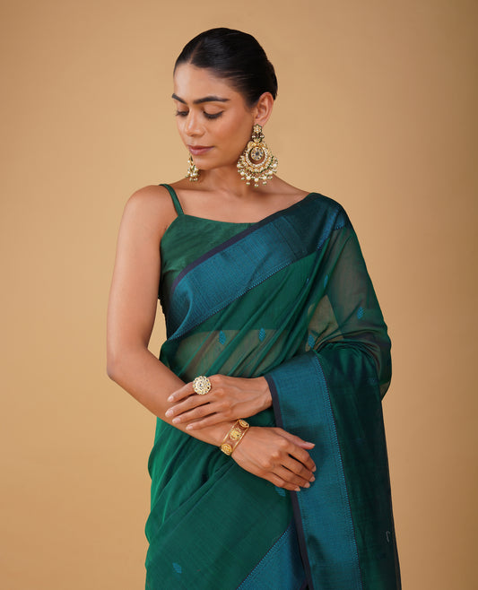 BOTTLE GREEN MAHESHWARI SAREE WITH PEACOCK BLUE RESHAM BORDER & PALLA