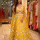 YELLOW COLOUR NET HAND EMBROIDERED SKIRT WITH DESIGNER CTOP TOP BLOUSE EMBELLISHED WITH SEQUINS, CUTDANA & PEARL WORK