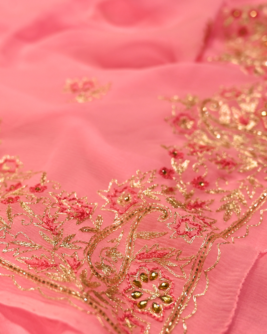 ELECTRIC BABY PINK COLOUR ZARI AARI & RESHAM EMBROIDERED BORDER, BOOTIES IN PLANT BASED, PINK COLOUR CHIFFON SAREE