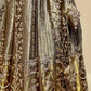 ANTIQUE GOLDEN TISSUE LEHENGA EMBELLISHED WITH SEQUINS, CUTDANA & RESHAM WORK